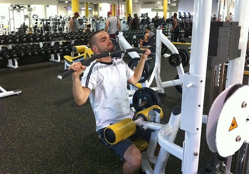 Man using a lat pull down machine