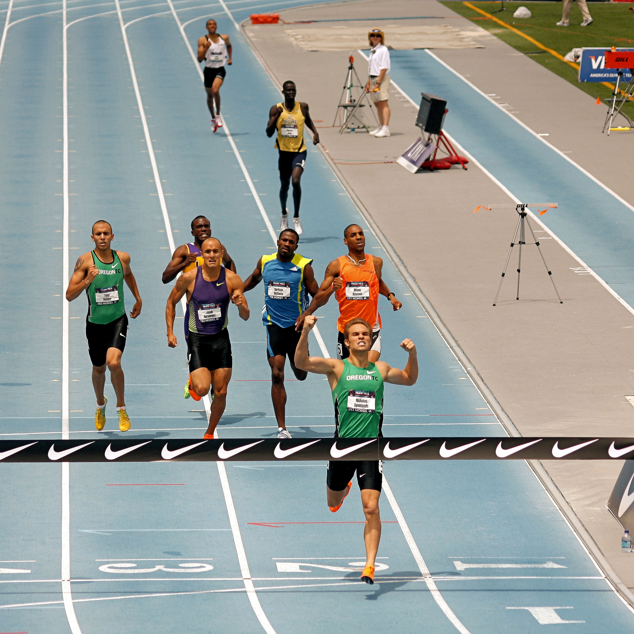 man finishing and winning a sprint