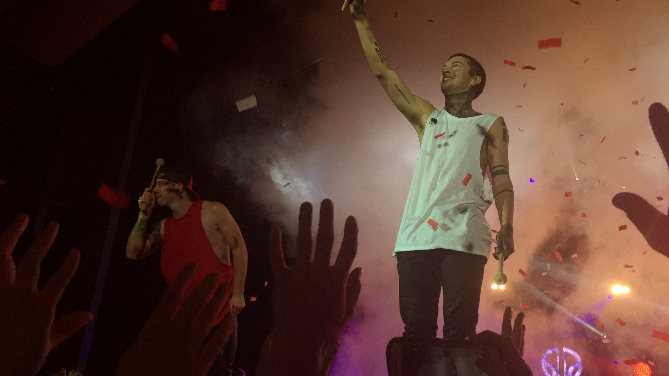 Twenty One Pilots playing drums on top of the crowd!