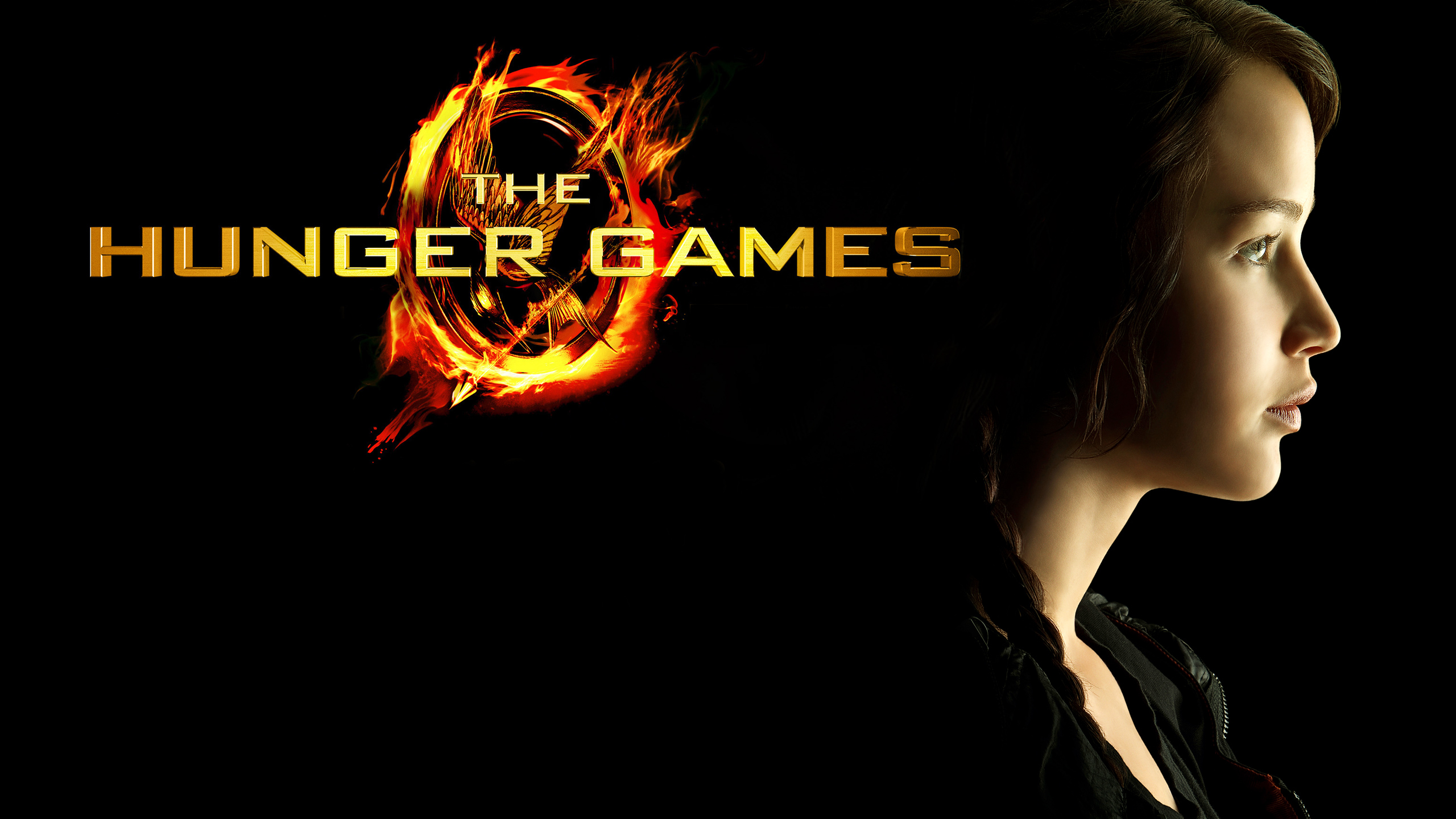 Jennifer Lawrence near Hunger Games sign