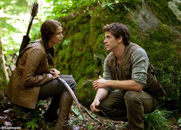 Katniss and Gale in the woods in the first Hunger Games movie