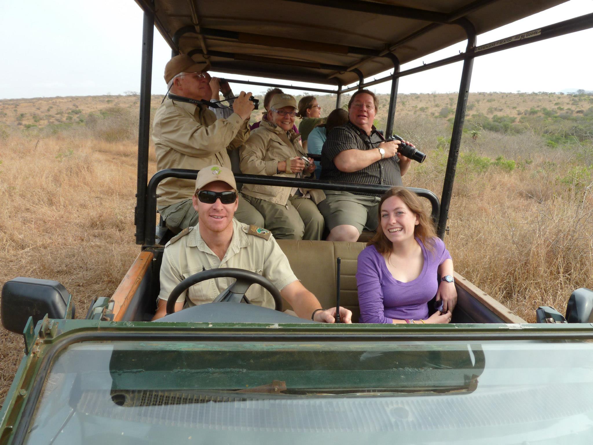 Safari vehicle with guide and tourists