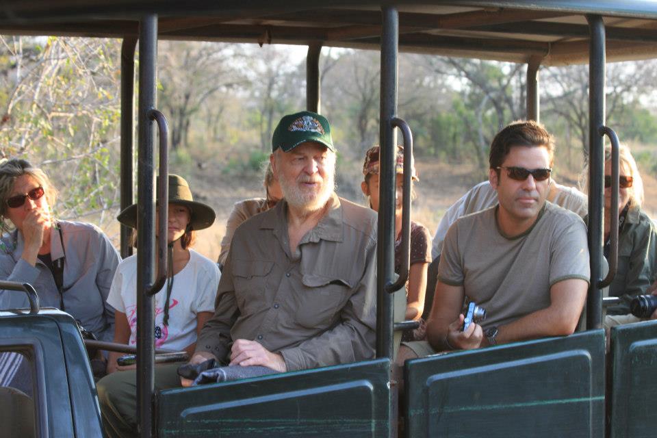 Safari vehicle with people looking out from it